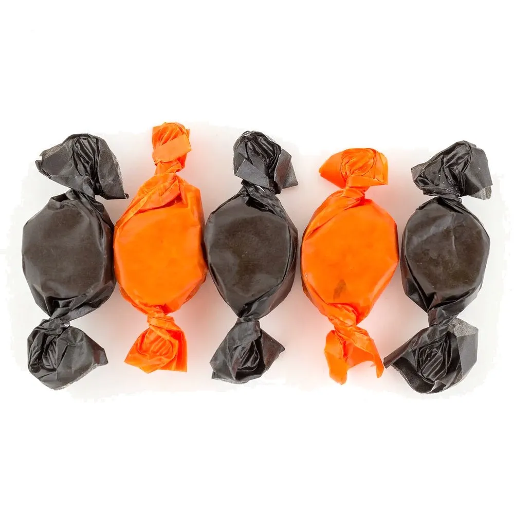Peanut Butter Kisses in orange and black wax paper wrappers